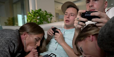 Tanned European women suck and ride two young gamers' cocks