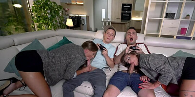 Tanned European women suck and ride two young gamers' cocks