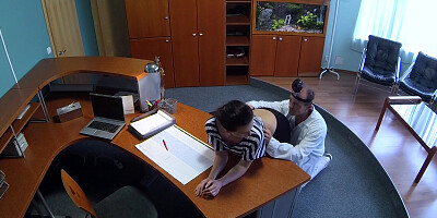 Doctor bangs female patient on front desk