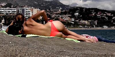 Shameless teens caught topless on the beach