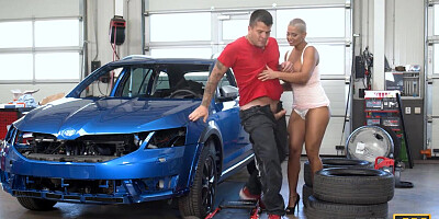 Busty blonde licks mechanic's ass in the garage