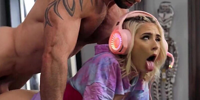 Jessie Saint playing video games while Danny Steele bangs her