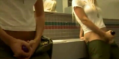 Riley Steele and Jesse Jane are taking turns deepthroating a rock firm hard-on, in a public rest room