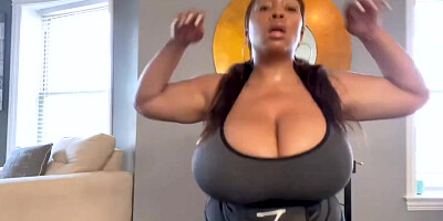 Gigantic breasted, Dark-Hued chick is posing stripped to the waist on web cam, because it exhilarates her a pile