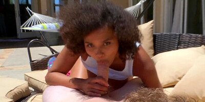 Curly-haired ebony girl gets a white cock in the yard