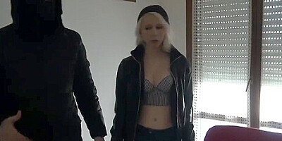 Girl in leather jacket and boots tied up and gagged