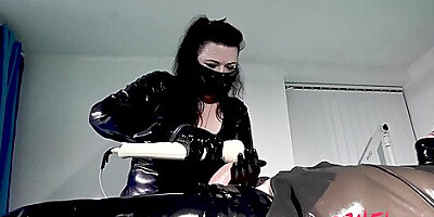 Rubber Nurse Edges And Milks A Rubber Gimp