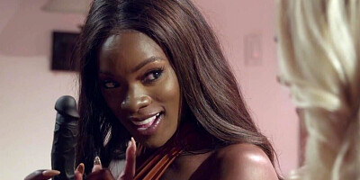 Ana Foxxx and her blonde friend playing with a toy