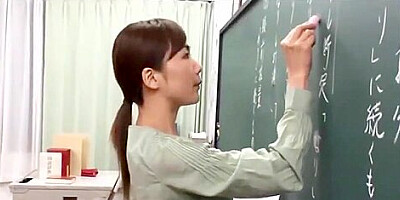 Japanese teacher gives a valuable lesson at the blackboard