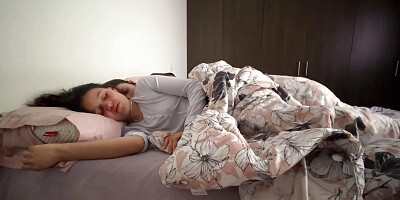 Lesbians snuggle in bed and touch their asses
