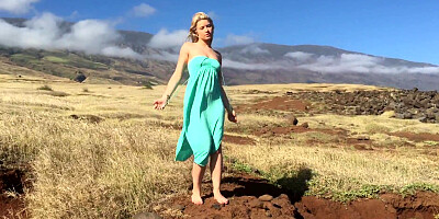 Gorgeous blonde Anikka Albrite posing among cloud-shrouded mountains