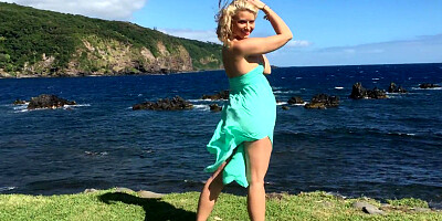 Gorgeous blonde Anikka Albrite posing among cloud-shrouded mountains