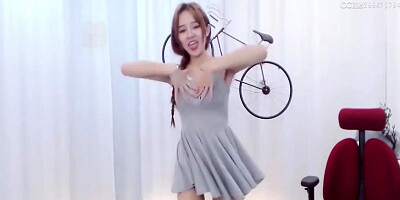 Enrapturing dark haired in a supah brief sundress is dancing in front of the web camera