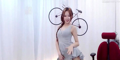 Enrapturing dark haired in a supah brief sundress is dancing in front of the web camera