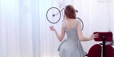 Enrapturing dark haired in a supah brief sundress is dancing in front of the web camera