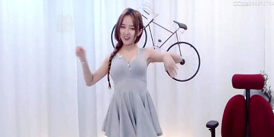 Enrapturing dark haired in a supah brief sundress is dancing in front of the web camera
