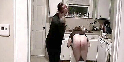 Teen boy spanked by mom