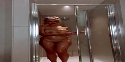 Marvelous, platinum-blonde cougar with meaty, hard hooters is having a bathroom in front of the camera