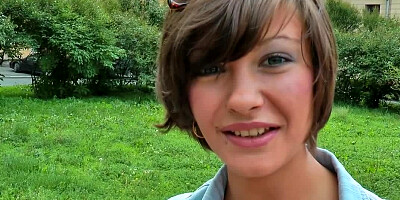 A brunette shows her natural tits and puffy nipples outside