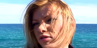 Blonde MILF walks on the beach before sex