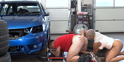 Short haired blonde MILF is licking the car mechanic