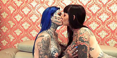 Two Beautiful Women With Tattoos Fuck Each Other With A Strap On