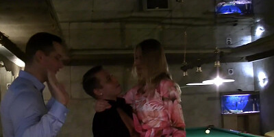 Slutty young girl sucks two cocks at the same time in the sauna