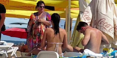 Girl sunbathe topless but voyeur films tits