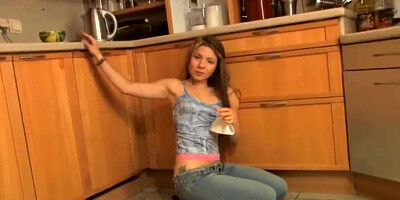 Teenager striptease in the kitchen