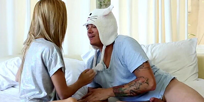 Friend in bunny hat penetrates girl's shaved pussy on the bed