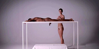 Charlotta is nude and wanking a mind-blowing, ebony boy from under the table, just for joy