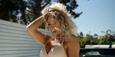 Curly hair luscious blonde model Sara