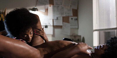 Two passionate black bitches fucking in the office