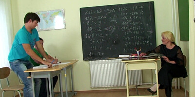 Elder blond tutor threeway in the classroom