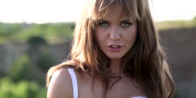 Erotic model Bella Baby in high heels strips in the open air