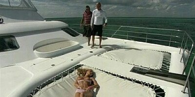 Warm blonde trio way on the boat