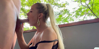 Thick blonde is sucking and banging on the balcony