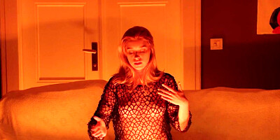 Lonely girl lights candles and takes off clothes