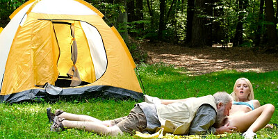 Blonde satisfied by old stranger during picnic in forest