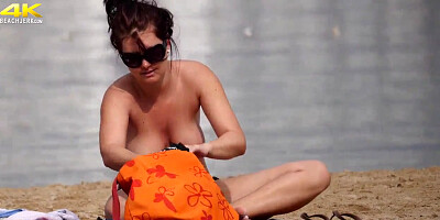 Big-Chested German Filmed on Bra-Less Beach by Hidden Cam