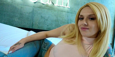 A bimbo with a hairy pussy is spreading her ass cheeks