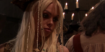 Two hot ladies with pirate hats are sucking a big cock