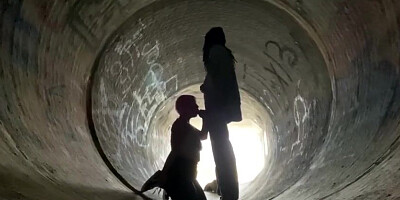 Inexperienced doll is getting on all fours on the ground and deep throating a rock rigid boner in a public place