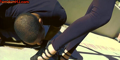 HJ busty domina with big boobs jerking black cock outdoor