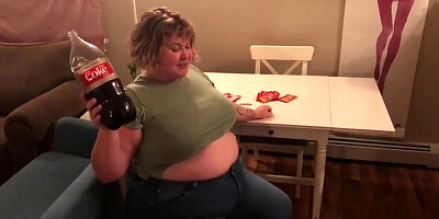 Meaty fuckslut, Alice is licking and demonstrating her large abdomen, in front of the camera