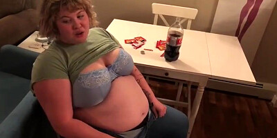 Meaty fuckslut, Alice is licking and demonstrating her large abdomen, in front of the camera