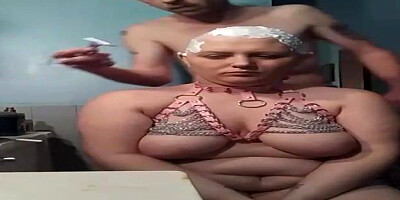 Lush female with monstrous globes is getting her head shaven in front of the camera