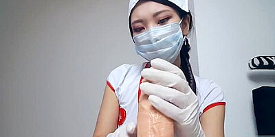 ASIAN NURSE GIVES DILDO HANDJOB WITH SURGICAL MASK AND GLOVES