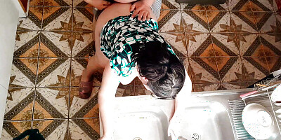 Stepson surprises stepmom with a hard fuck in the kitchen