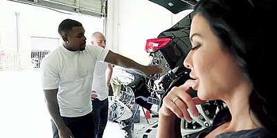 Mature brunette in erotic stockings and garter belt is having interracial sex with a black guy